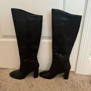 Black Calvin Klein knee high boots with a 3-4 inch heel